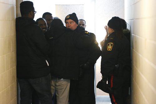 January 6, 2015 - 150106 -  As friends and family gather outside their apartment Bethlehem Eliso's father thanks Winnipeg police for bringing his daughter home Tuesday, January 6, 2015. John Woods / Winnipeg Free Press