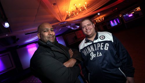 ARIEH KRAVETS and RAVI RAMBERRAN (left), pose in the banquet hall of their McPhillips Street hotel they are spending about $1 million on upgrades to the Lincoln Hotel, which they and their fathers purchased in Oct. 2013. See Murray McNeil story.  January 7, 2015 - (Phil Hossack / Winnipeg Free Press)