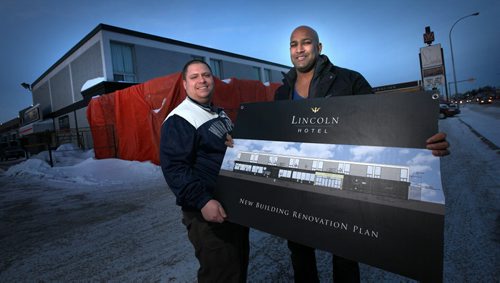 ARIEH KRAVETS and RAVI RAMBERRAN (right), poseoutside of their McPhillips Street hotel, they are spending about $1 million on upgrades to the Lincoln Hotel, which they and their fathers purchased in Oct. 2013. See Murray McNeil story. January 7, 2015 - (Phil Hossack / Winnipeg Free Press)