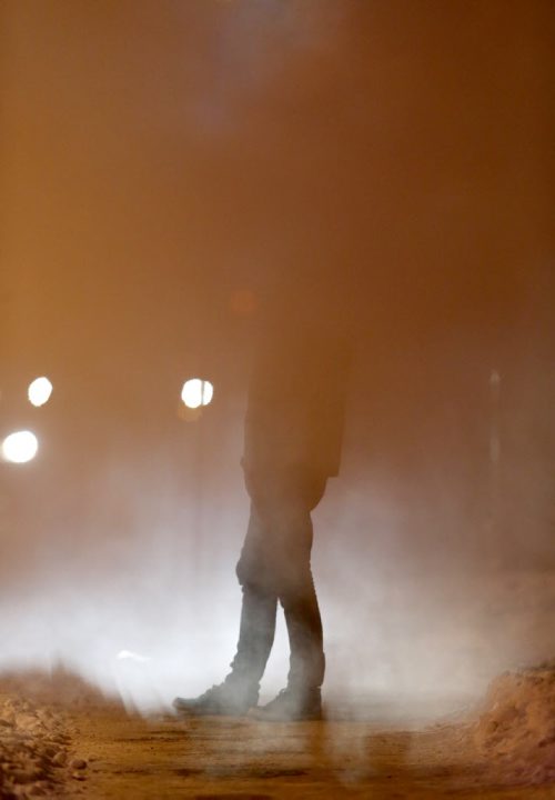 Jared Thompson stands in a steam vent on Smith Street near York Avenue while waiting for a ride to pick him up, Wendesday, January 7, 2015. (TREVOR HAGAN/WINNIPEG FREE PRESS)