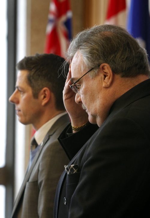 Winnipeg Mayor Brian Bowman,left, and Bruno Burnichon, Honourary Counsul for France in Winnipeg and members of Council took part in a vigil to offer condolences to the victims and their families after the tragic events in France. Geoff Kirbyson story. Wayne Glowacki/Winnipeg Free Press Jan. 8 2015