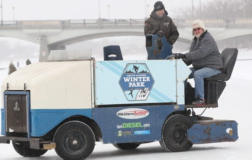 Winnipeg Free Press columnist Doug Spiers learns how to drive the Fork Ice grooming vehicle with Forks employee Dave Pancoe- Manager special projects   See Doug Speirs column- Jan 08, 2015   (JOE BRYKSA / WINNIPEG FREE PRESS)