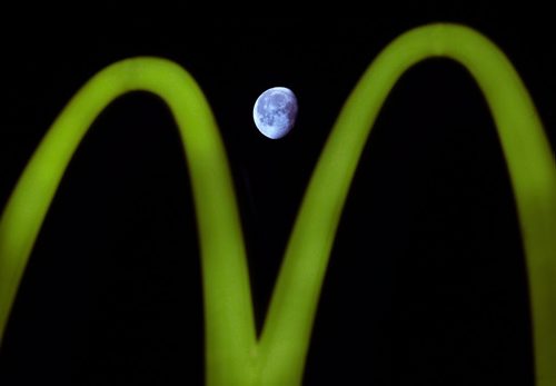 MC Moon- The moon 405385 km away from earth is farmed through the Golden Arches on Portage Ave Friday as it is approaching its third quarter Standup Photo- Jan 09, 2015   (JOE BRYKSA / WINNIPEG FREE PRESS)
