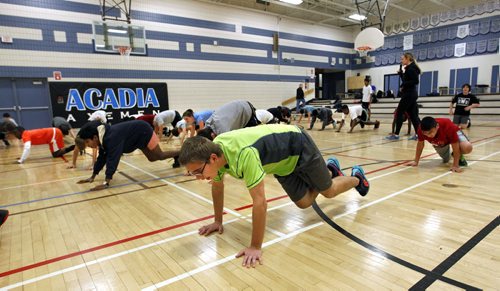 Acadia Junior High School students take part in warm up exercises in their gym class. Nick Martin story on Manitoba student health survey. / Wayne Glowacki Winnipeg Free Press Jan. 9 2015
