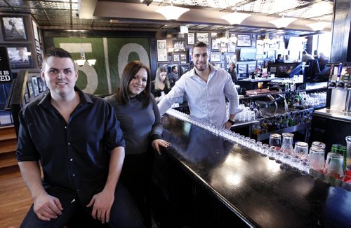 Finance. For commercial real estate column.   From left, Riley Creighton,GM, with assistant managers Melissa Ross and Garret Chapa in The Pint Public House at  274 Garry St.  Murray McNeill story.    Wayne Glowacki/Winnipeg Free Press Jan. 9 2015