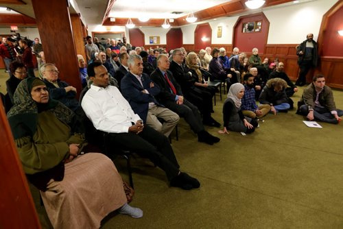 Community members listen as Shahina Siddiqui speaks at Winnipeg Central Mosque at a gathering to stand in solidarity following the recent attacks in Paris, Friday, January 9, 2015. (TREVOR HAGAN/WINNIPEG FREE PRESS)