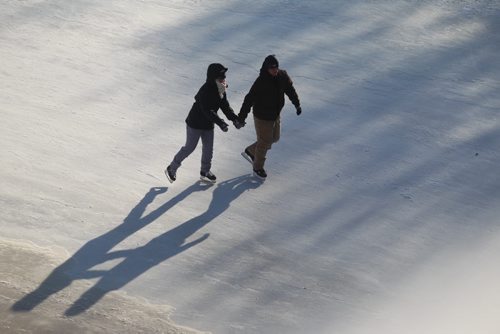 A couple hold hands as they skate on the River Trail Saturday afternoon at the Forks.   Jan 10, 2015 Ruth Bonneville / Winnipeg Free Press