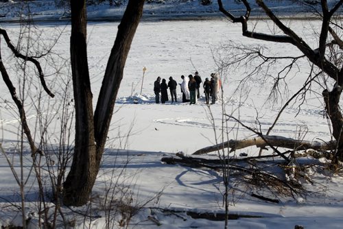 Father Gregory Scratch (white beard), Deacon  Matthew Beynon and members of St. Nicholas Orthodox Church,  stepped out onto the frozen Red River near Burrows Ave. for the Great Blessing of Waters held on the feast of Theophany or Epiphany Saturday.  See Kevin Rollason's story.  Jan 10, 2015 Ruth Bonneville / Winnipeg Free Press