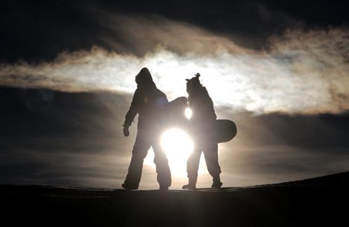 Mary Ann Funk and Britney Lamy toboganning at Garbage Hill on a chilly afternoon, Saturday, January 10, 2015. (TREVOR HAGAN/WINNIPEG FREE PRESS)