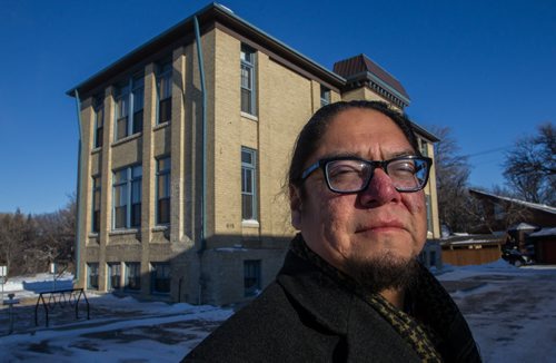 Maeengan Linklater a longtime urban aboriginal community volunteer outside 615 Academy, the site of the former Assiniboine Indian Residential School where subjects were subjected to ESP experiments in the 1940's. 150111 - Sunday, January 11, 2015 -  (MIKE DEAL / WINNIPEG FREE PRESS)