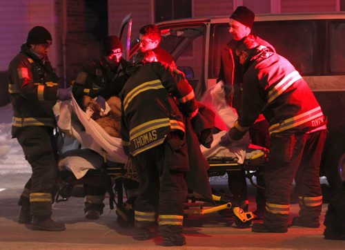 Police and Fire and Paramedics remove a person who was thought to have been stabbed in the 800 block of Mountain Ave near 730 AM this morning Breaking News- Jan 12, 2015   (JOE BRYKSA / WINNIPEG FREE PRESS)