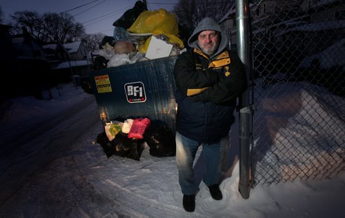 Property manager John Phillips says city has contracts with private contractors to pick up garbage at small apartment blocks twice a week but they dont. The bin at 400 Toronto was supposed to be picked up Tuesday and Friday last week but not done. Garbage overflowing. See Aldo Santin story. January 12, 2015 - (Phil Hossack / Winnipeg Free Press)