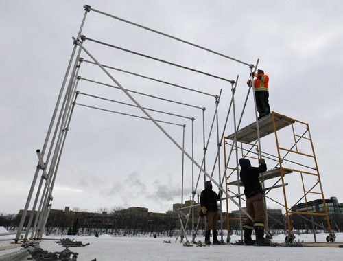 The scaffolding is going up and the kitchen is being constructed Tuesday morning for this year's  RAW:almond winter fine dining experience on the frozen Assiniboine River where it meets the Red River. The structure designed this year by UK architects OS31 is planned to open  Jan. 22 to Feb.11.     Wayne Glowacki / Winnipeg Free Press ¤Jan. 13 2015