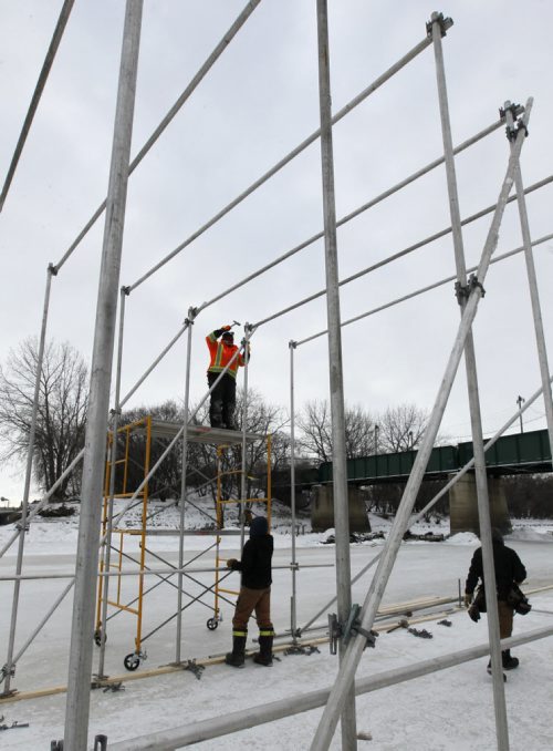The scaffolding is going up and the kitchen is being constructed Tuesday morning for this year's  RAW:almond winter fine dining experience on the frozen Assiniboine River where it meets the Red River. The structure designed this year by UK architects OS31 is planned to open Jan. 22 to Feb.11.     Wayne Glowacki / Winnipeg Free Press ¤Jan. 13 2015