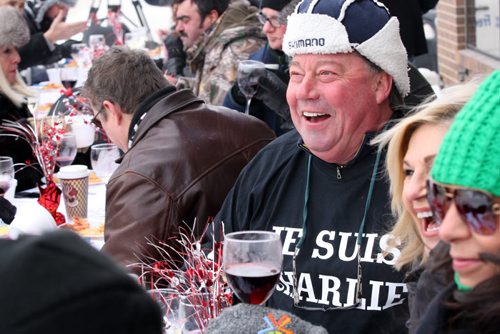 Jean Louis Danguy, top, and his friends enjoy Lobster Bisque Soup and Seafood Rice was served at the annual Polar Bear outdoor Lunch At Gus & Tonys at the Park 2015 Portage Ave - Gus & Tonys at the Park donate the food proceeds will go to Manitoba Theater for Young People - Jan 13, 2015   (JOE BRYKSA / WINNIPEG FREE PRESS)