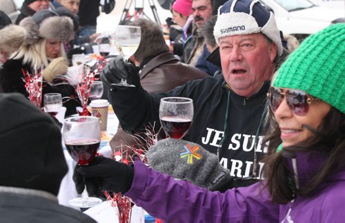 Jean Louis Danguy, with blue hat, toasts as hime and his friends enjoy Lobster Bisque Soup and Seafood Rice was served at the annual Polar Bear outdoor Lunch At Gus & Tonys at the Park 2015 Portage Ave - Gus & Tonys at the Park donate the food proceeds will go to Manitoba Theater for Young People - Jan 13, 2015   (JOE BRYKSA / WINNIPEG FREE PRESS)