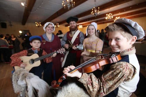 Twelve-year-old Miguel Sorin (far right)  plays the fiddle as he has his picture taken with the rest of his family - sister Amélie - 13yrs, dad Marcel, mom Michelle and Cabrel - 10yrs at the press conference Tuesday at Festival Park.  Note, daughter Catherine Sorin - 16yrs, not in photo.   Jan 13, 2015 Ruth Bonneville / Winnipeg Free Press