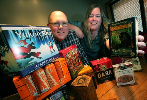 Sister brother team, Kelly Rasmussen and her brother Colin Hickson pose in their Selkirk based Sterling Packaging's boardroom with samples of the many specialized boxes and packaging they shape and print. Kirbyson story. January 13, 2015 - (Phil Hossack / Winnipeg Free Press)