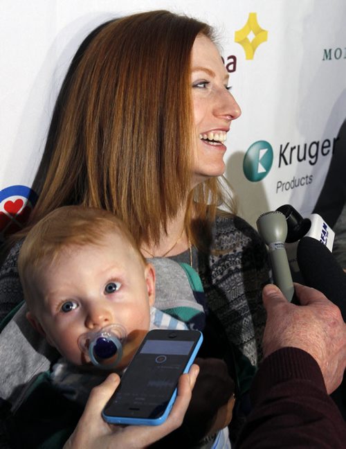 Skip Kristy McDonald with her 8 mos. old son Alex, at the news conference Wednesday to announce the seeding and the full draw of the 2015 Scotties Tournament of Hearts held January 21-25 at the Winkler Arena in Winkler, MB.  Melissa Martin story Wayne Glowacki / Winnipeg Free Press ¤Jan. 14 2015