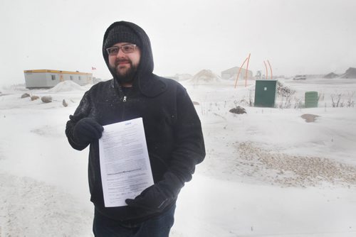 Paul Samborski of Samborski Environmental Ltd shows warrant issued by Provincial Environmental officers today to give them access on his property at 132 Samborski Drive to take samples-The southwest Winnipeg composting company has been locked in a regulatory spat with Conservation for eight years. It was ordered to clean up its business by Dec. 1, by removing all composting material from the site off McGillivray Boulevard or the province would do it for them and hand them the bill. See Story- Jan 14, 2015   (JOE BRYKSA / WINNIPEG FREE PRESS)