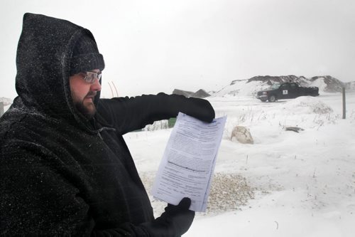 Paul Samborski of Samborski Environmental Ltd shows warrant issued by Provincial Environmental officers today to give them access on his property at 132 Samborski Drive to take samples-The southwest Winnipeg composting company has been locked in a regulatory spat with Conservation for eight years. It was ordered to clean up its business by Dec. 1, by removing all composting material from the site off McGillivray Boulevard or the province would do it for them and hand them the bill. See Story- Jan 14, 2015   (JOE BRYKSA / WINNIPEG FREE PRESS)