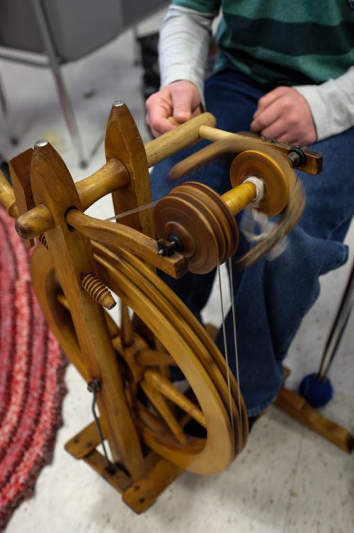 Michael Elias, 12, spins yarn on one of the four spinning wheels the class has access to. Elaine Owen, a teacher at Miami School in Miami, Manitoba has undertaken a huge project to teach her students some core values. Over the last six months, she has gathered raw wool and shown her students the process through washing, carding, dyeing and spinning the wool and then using looms, making mittens, scarves, etc. Elaine has four spinning wheels in her classroom and the students are donating their crafted items to a local shelter.  150113 - Wednesday, January 14, 2015 -  (MIKE DEAL / WINNIPEG FREE PRESS)