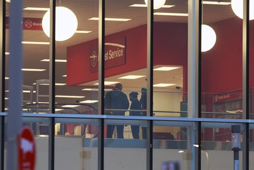 Employees chat inside the brand new Target store on St James St Thursday morning before it opens- Target has announced that they are closing all stores in Canada this morning-Breaking News- Jan 15, 2015   (JOE BRYKSA / WINNIPEG FREE PRESS)
