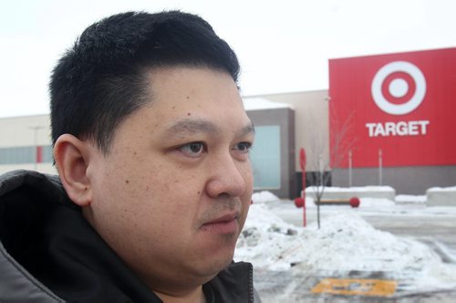 Customer Jerome Baldevas outside the brand new Target store on St James St Thursday morning.- Target has announced that they are closing all stores in Canada this morning-See Adam Wazny story- Jan 15, 2015   (JOE BRYKSA / WINNIPEG FREE PRESS)
