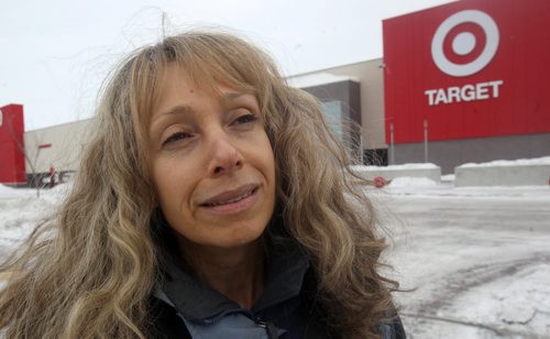 Customer Candace Ludwig outside the brand new Target store on St James St Thursday morning.- Target has announced that they are closing all stores in Canada this morning-See Adam Wazny story- Jan 15, 2015   (JOE BRYKSA / WINNIPEG FREE PRESS)