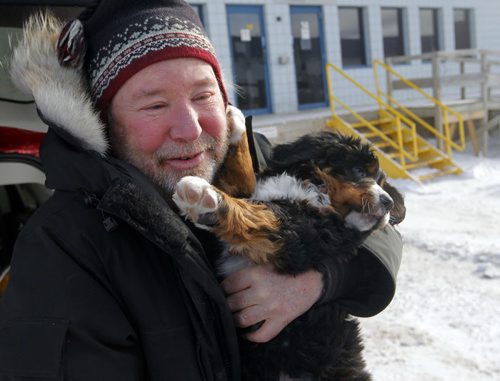 LOCAL - STANDUP - Bill Friday from the Kenora area finally gets to meet his eight-week-old Bernese Mountain Dog named Levon. Westjet almost lost the dog. BORIS MINKEVICH /WINNIPEG FREE PRESS. January 15, 2015