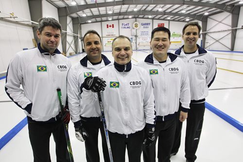 A team from Brazil skipped by Marcelo Mello (centre) is competing in the Manitoba Open Bonspiel. The team (l-r) Raphael Monticello, Filipe Nunes, Marcelo Mello, Sergio Vilela and Scott McMullan took part in the opening ceremonies and threw the ceremonial first rock to kick off the Bonspiel at the Fort Garry Curling Club Thursday evening.   150115 January 15, 2015 Mike Deal / Winnipeg Free Press