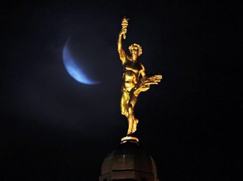 Light Clouds- The moon is masked by light clouds behind the golden boy on the Manitoba Legislature Friday morning- Today we will see a mainly cloudy day with a slight chance of flurries, with a high of -9c-Standup Photo- Jan 16, 2015   (JOE BRYKSA / WINNIPEG FREE PRESS)