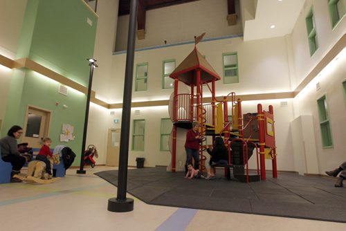 LOCAL - West End Commons (formerly St. Matthews Anglican Church). The old church has been converted into apartments, a playground, community meeting spaces and its new smaller sanctuary is now home to five church groups. This is a general shot of the indoor common playground area. CAROL SANDERS yarn. BORIS MINKEVICH/WINNIPEG FREE PRESS. JANUARY 16, 2015