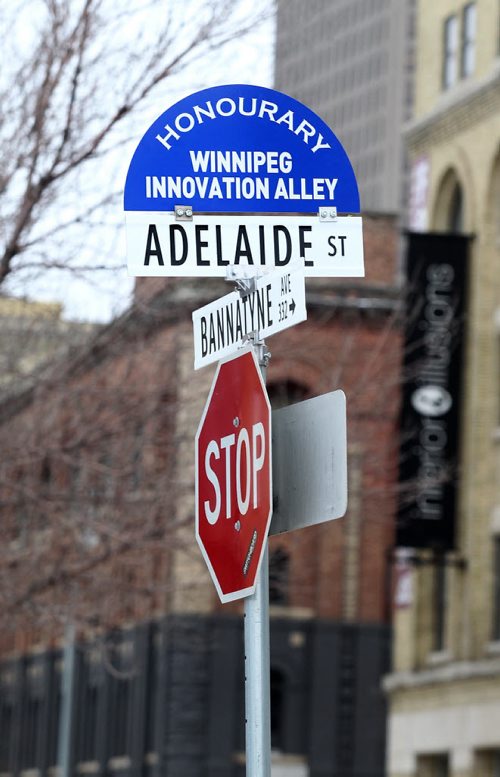 A new sign entittled "Honourary Winnipeg Innovation Ally" was placed on top of the Adelaide St. and Bannatyne Ave. Sign after being unveiled Friday by Mayor Brian Bowman.   Jan 16, 2015 Ruth Bonneville / Winnipeg Free Press