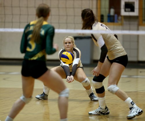 University of Manitoba Bisons' Lexi Janovcik receives a serve by the Alberta Pandas during volleyball action at the U of M, Friday, January 16, 2015. (TREVOR HAGAN/WINNIPEG FREE PRESS)