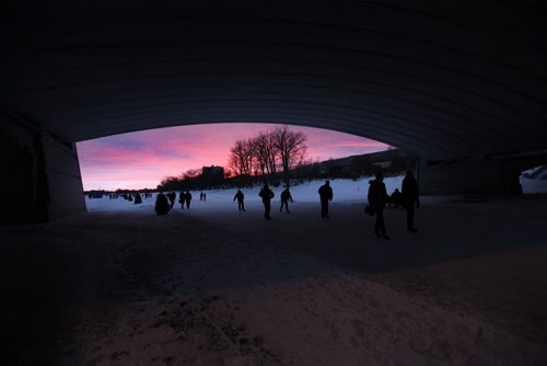 A pink hue brightened the sky as people took advantage of the warm temperatures to skate along the River Trail on the Red River Saturday.   Standup photo  Jan 17, 2015 Ruth Bonneville / Winnipeg Free Press