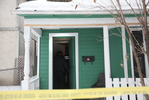 A forensic team makes their way into 101 Lorne Ave. Saturday afternoon to further investigate the death of a female from an altercation that occurred in the early morning hours.   Jan 17/2014  Ruth Bonneville / Winnipeg Free Press.