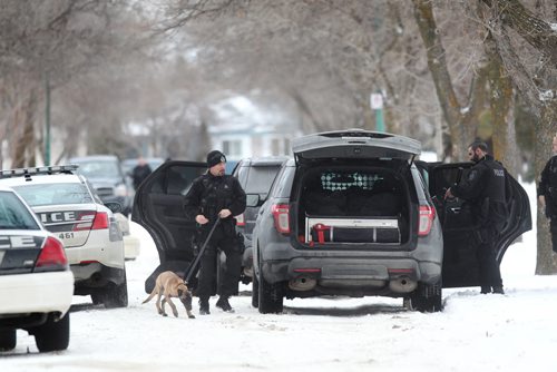 Police officers including a canine unit surrounded 311 Larche Street In Transcona Saturday afternoon but then left without incident.  The only information obtained was from a neighbour who said the couple living in the rental home have a extremely volatile relationship.    Jan 17/2014  Ruth Bonneville / Winnipeg Free Press.