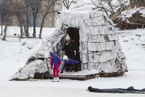 Skaters leave one of the warming huts that dot the landscape along the river trail. Hundreds took advantage of the slightly warmer weather and headed to The Forks for the kick-off of its winter adventure programming. 150118 - Sunday, January 18, 2015 -  (MIKE DEAL / WINNIPEG FREE PRESS)