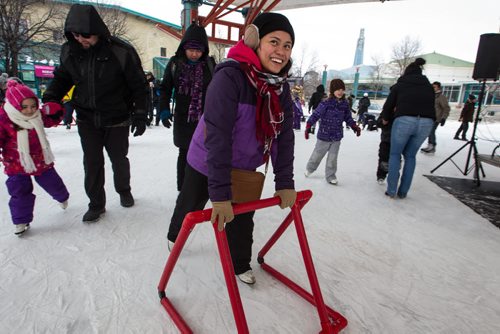 Arleene Quiutoras skating for the first time ever under the canopy at The Forks. Hundreds took advantage of the slightly warmer weather and headed to The Forks for the kick-off of its winter adventure programming. 150118 - Sunday, January 18, 2015 -  (MIKE DEAL / WINNIPEG FREE PRESS)