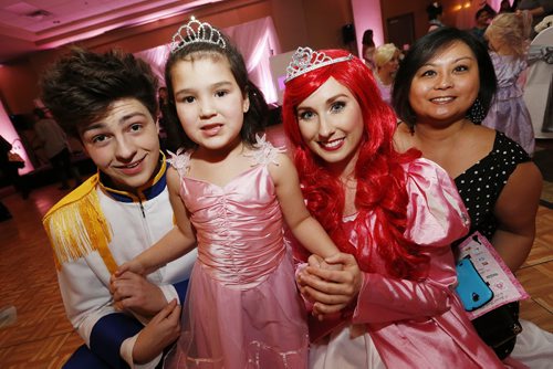 January 18, 2015 - 150118  -  Princess Ariel and Prince Eric are photographed with Violet (4) and her mother Michelle Ramos at the first annual Royal Princess Ball in support of The Children's Hospital Foundation of Manitoba at the Viscount Gort Hotel Sunday, January 18, 2015. John Woods / Winnipeg Free Press