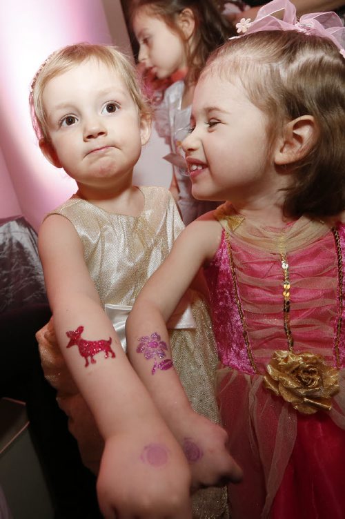 January 18, 2015 - 150118  -  Luzy Enns (3) and her cousin Sonja Kuhl (2) show off their glitter tattoos at the first annual Royal Princess Ball in support of The Children's Hospital Foundation of Manitoba at the Viscount Gort Hotel Sunday, January 18, 2015. John Woods / Winnipeg Free Press