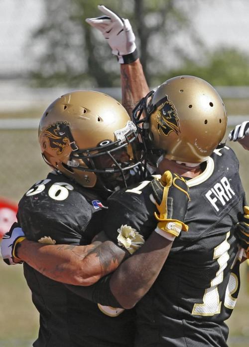 John Woods / Winnipeg Free Press / September 15/07- 070915  - U of Manitoba Bison RB Matt Henry (36) celebrates his TD drive with WR Terry Firr (15) in the first half of their game against the U of Calgary Dinos Saturday, September 15/07.