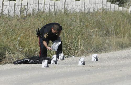 John Woods / Winnipeg Free Press / September 15/07- 070915  - A traffic cop investigates a fatal MVC on Ravelstone.   Cops were called to Ravelstone and Bienvenue to investigate the accident where one person died Saturday September 15/07.