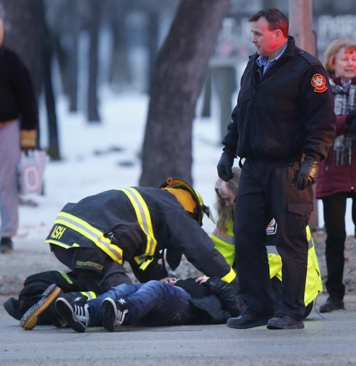A pedestrian was struck by a vehicle Monday morning at the intersection of Main St. and Mountain Ave. The pedestrian was transported to the hospital.  Wayne Glowacki/Winnipeg Free Press Jan. 19 2015