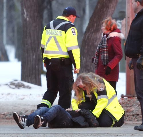 A pedestrian was struck by a vehicle Monday morning at the intersection of Main St. and Mountain Ave. The pedestrian was transported to the hospital.  Wayne Glowacki/Winnipeg Free Press Jan. 19 2015