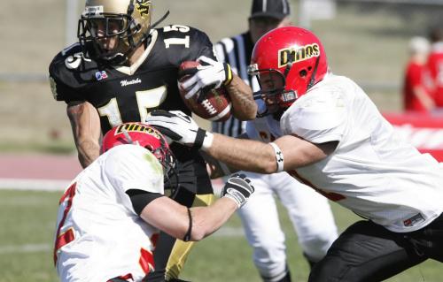 John Woods / Winnipeg Free Press / September 15/07- 070915  - U of Manitoba Bison WR Terry Firr (15) gets wrapped up by U of Calgary Dinos Matt Grohn (22)(L) and Andrea Bonaventura (2)  in the first half of their game in Winnipeg Saturday, September 15/07.