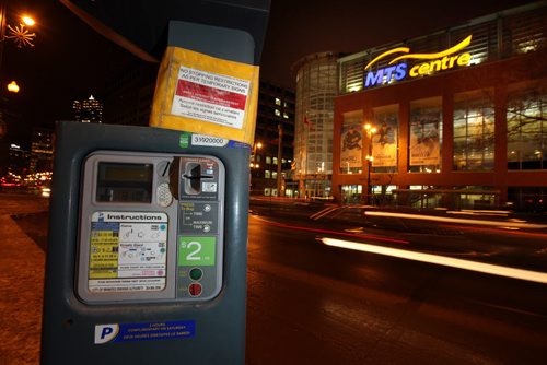A downtown parking station waits in front of the MTS Centre Monday night. See story re: evening parking fees proposed. January 19, 2015 - (Phil Hossack / Winnipeg Free Press)