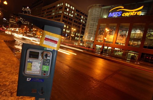 A downtown parking station waits in front of the MTS Centre Monday night. See story re: evening parking fees proposed. January 19, 2015 - (Phil Hossack / Winnipeg Free Press)