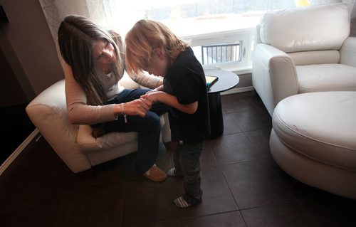 Four yr old Cian Anaka interacts with mom Kristi while playing in the family room Monday. See Mary Agnes story re: Child Care. January 19, 2015 - (Phil Hossack / Winipeg Free Press)